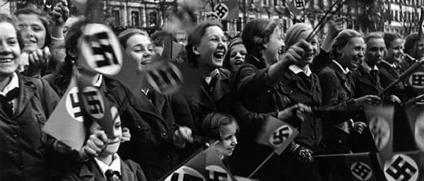 Austrians welcoming the Nazis after the Anschluss. For decades, Austria regarded itself as the first victim of Nazism.