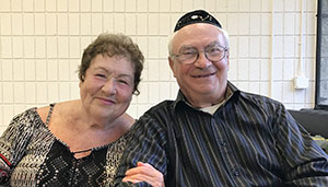 A wife and husband receive Hardship Fund payments